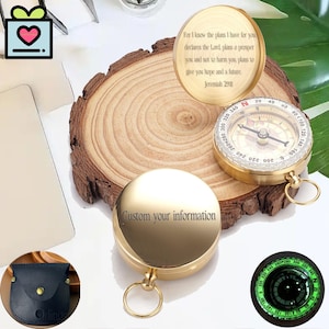 May include: A gold-colored compass with a ring for attachment, a leather pouch, and a wooden slice. One compass has the text "Custom your information". Another compass has the text "For I know the plans I have for you...Jeremiah 29:11".