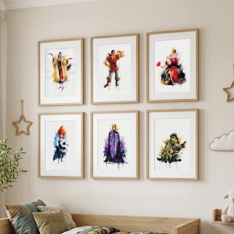 May include: Six framed watercolor prints of Disney villains hang on a wall. The artwork features characters like Cruella de Vil, Gaston, and the Queen of Hearts. Each print is in a wooden frame, adding a classic touch to the colorful illustrations.