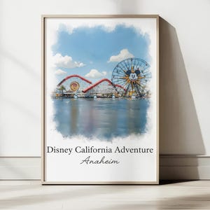 May include: A framed watercolor print of Disney California Adventure in Anaheim. The image features the Pixar Pal-A-Round Ferris wheel with a Mickey Mouse face, a red roller coaster, and the text "Disney California Adventure Anaheim."