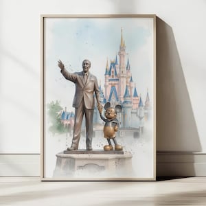May include: Framed watercolor print featuring a statue of a man and Mickey Mouse in front of a castle. The artwork has a soft, pastel color palette with a light blue sky and a beige frame.
