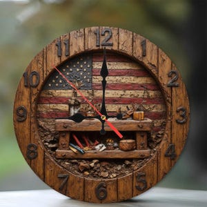 May include: A round wooden clock with a rustic design. The clock face features the American flag and a detailed workshop scene. The clock hands are black with a red second hand. The numbers are carved into the wooden frame.