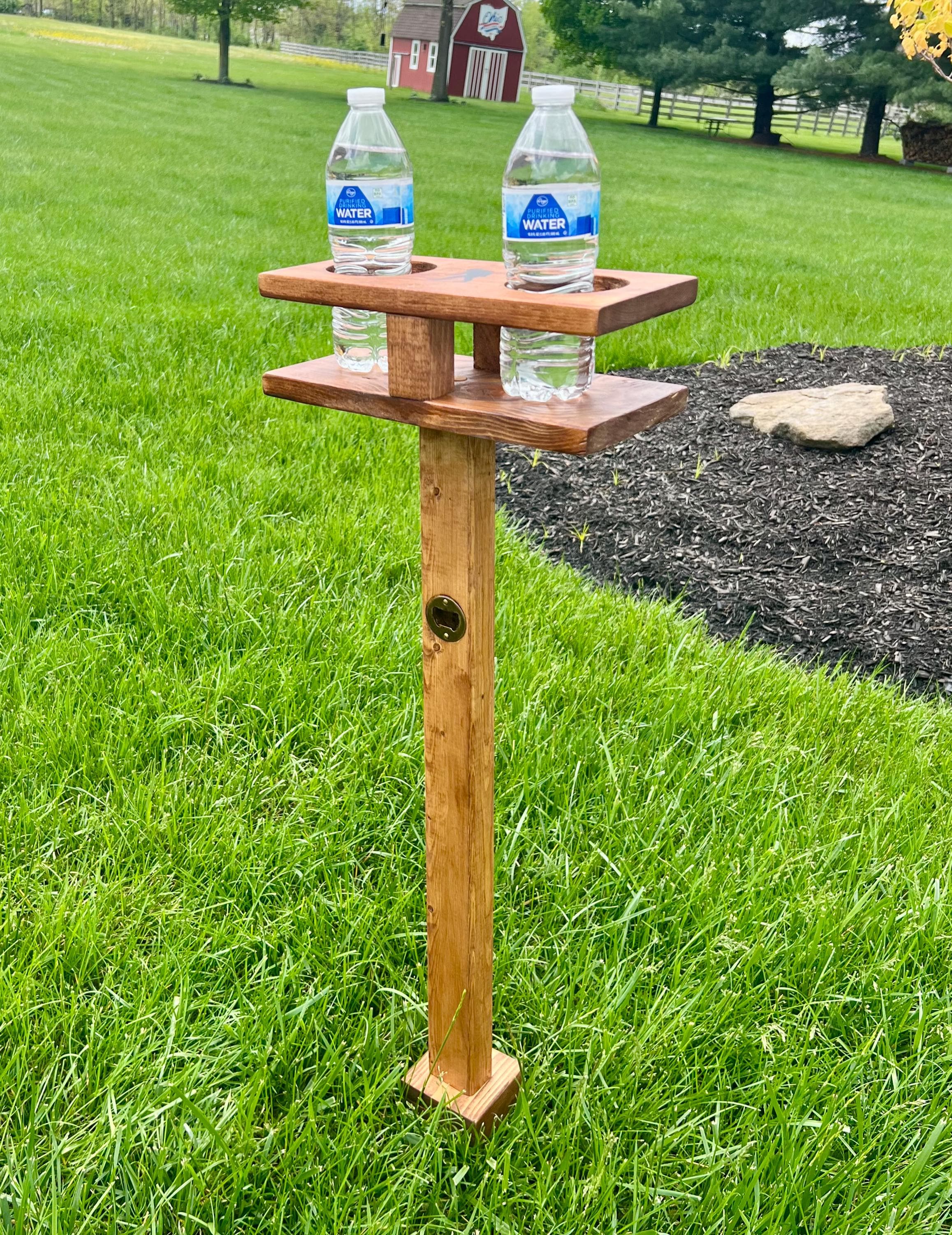 Set of 2 "Bigfoot" branded Corn Hole drink holders. Sturdy metal stakes allow for easy placement and removal. Bottle opener attached,