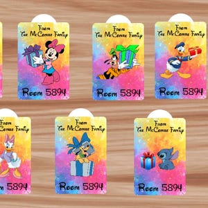 May include: A set of gift tags with Disney characters like Mickey and Minnie Mouse, Goofy, Donald Duck, Daisy Duck, Pluto, and Stitch. Each tag has the text "From The McConne Family" and "Room 5892" or "Room 5894". The tags are brightly coloured.