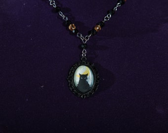 Gothic black cat and crescent moon black and champagne beaded necklace