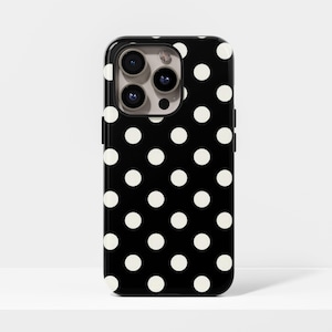 May include: Black phone case with a white polka dot pattern. The case has a glossy finish and a camera cutout. The design features evenly spaced white circles against a black background, creating a classic and stylish look.