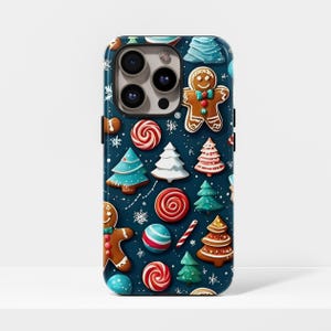 Może przedstawiać: Etui na smartfona z świątecznym motywem bożonarodzeniowym. Etui przedstawia piernikowych ludzików, choinki i laski cukrowe w kolorze czerwonym, białym i zielonym na ciemnoniebieskim tle. Płatki śniegu są rozrzucone.