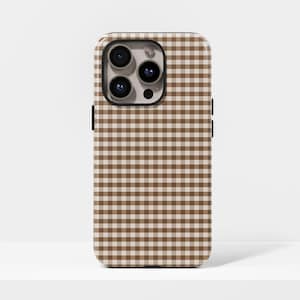May include: A phone case with a brown and white gingham pattern. The case has a black border and a camera cutout with three lenses. The case is designed to fit a smartphone and provides protection.