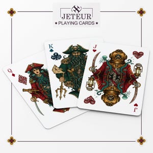 May include: Playing cards featuring unique pirate-themed illustrations. The cards showcase a Queen, King, and Jack, each with detailed artwork and vibrant colors. The deck is branded with the text "Jeteur Playing Cards".