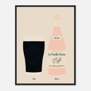 May include: A framed print showing a pint of dark beer labelled "His" and a pink wine bottle labelled "Hers". The wine bottle has a rooster and hen illustration and the text "La Vieille Ferme". The background is a light beige.