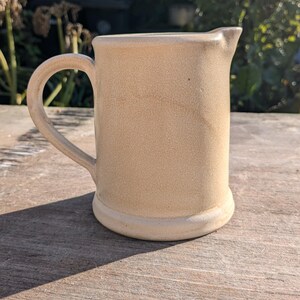 Jug, handmade on the wheel in stoneware.  Ceramic sauce, milk, gravy, salad dressing pitcher, artisan for kitchen or dining table serveware.