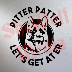 May include: Black and white silhouette of a German Shepherd dog's head with its tongue sticking out. The dog's head is inside a circle with the text "Pitter Patter Let's Get At'er" around the circle.