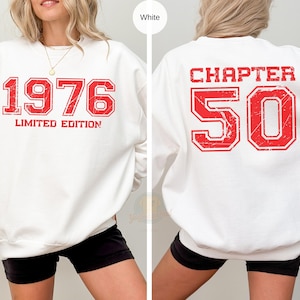 May include: White sweatshirt with red distressed text. The front displays "1976 LIMITED EDITION" and the back reads "CHAPTER 50". A casual, unisex top for milestone birthdays or anniversaries.