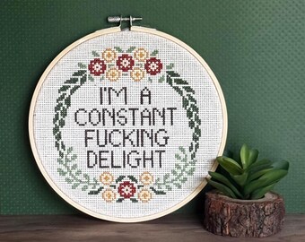 Finished framed cross stitch. I’m a constant fucking delight. Completed cross stitch design.