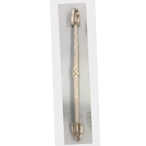 May include: A white braided leather strap with silver-toned metal accents at each end. The strap is approximately 12 inches long. The metal pieces have a decorative design. This item is likely a decorative accessory.