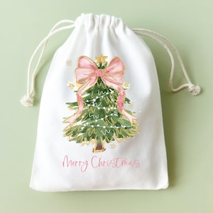 Christmas Party Favor Bags Drawstring Closure System Personalized Name Cotton Fabric Gift Wrapping Holiday Celebration Supplies Tree Pattern Design Pink Bow Accent Custom Present Packaging Reusable Eco Friendly Alternative Stocking Stuffer