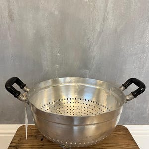 Vintage aluminum strainer with feet