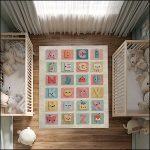 May include: A colorful alphabet rug with each letter displayed on a square. The letters are in various colors and feature cute illustrations. The rug is on a wooden floor, with two cribs on either side.