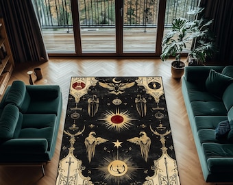 May include: A black area rug with a gold and red celestial design. The rug features a central sunburst, eagles, and other mystical symbols. The rug is rectangular and placed on a wooden floor, with green sofas on either side.