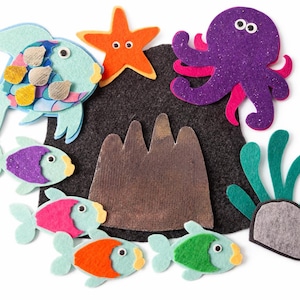 May include: A set of three ceramic mugs with a speckled, matte finish. The mugs are in shades of cream, light gray, and dark gray. Each mug has a simple, minimalist design, perfect for coffee or tea.