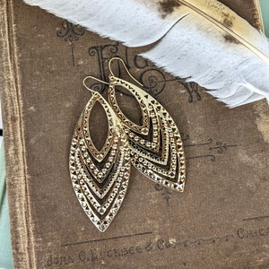 Lightweight gold toned metal feather leaf drop earrings
