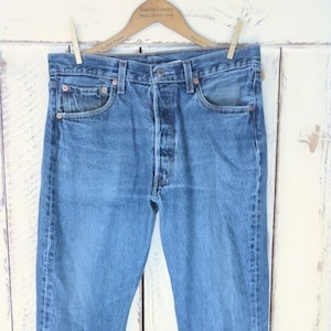Vintage blue 501 button fly denim jeans/high waisted straight leg blue jeans/faded Levi Strauss jeans