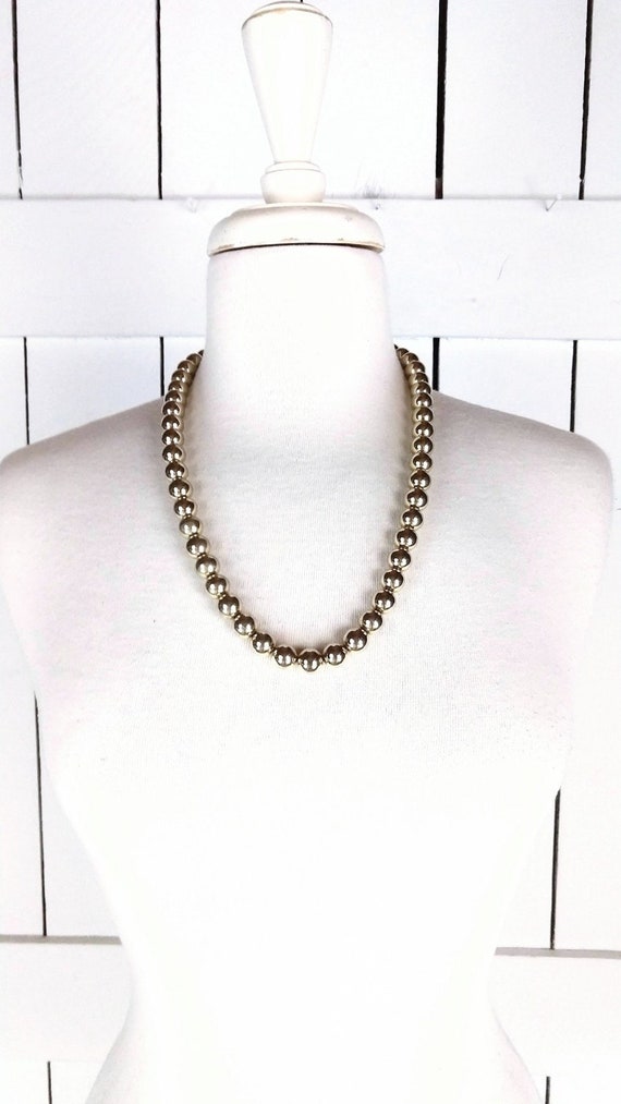 Vintage gold metal bead necklace
