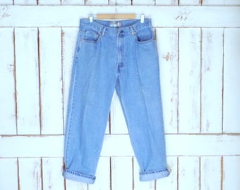Jeansy vintage 550 z zamkiem błyskawicznym/niebieskie jeansy z wysokim stanem i zwężaną nogawką/wyblakłe jeansy Levi Strauss
