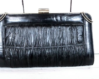 Bolso de mano vintage de piel de anguila negra con marco metálico