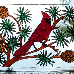Welcome sign with cardinal and pine cones