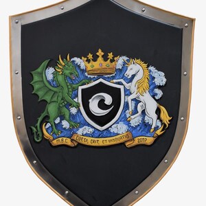Knight shield, hand-painted with a company logo, inspired by an image generated by AI.