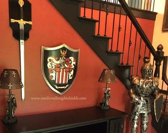 Custom family crest painting on a medieval knight shield, featuring a hand-painted coat of arms
