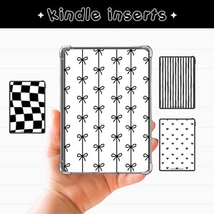 May include: A hand holding a Kindle with a clear case and a black and white bow pattern. Additional Kindle inserts feature a checkered design, vertical stripes, and a heart pattern. The text "kindle inserts" is at the top.