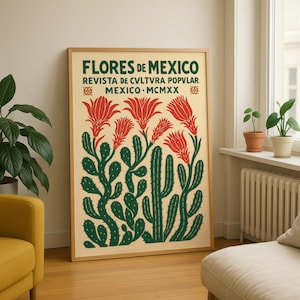 以下が含まれることがあります： 緑色の「Flores de Mexico」の文字が入った額入りのポスター。赤い花のイラストと緑色のサボテンの植物が描かれています。ポスターはベージュの背景と木製のフレームです。