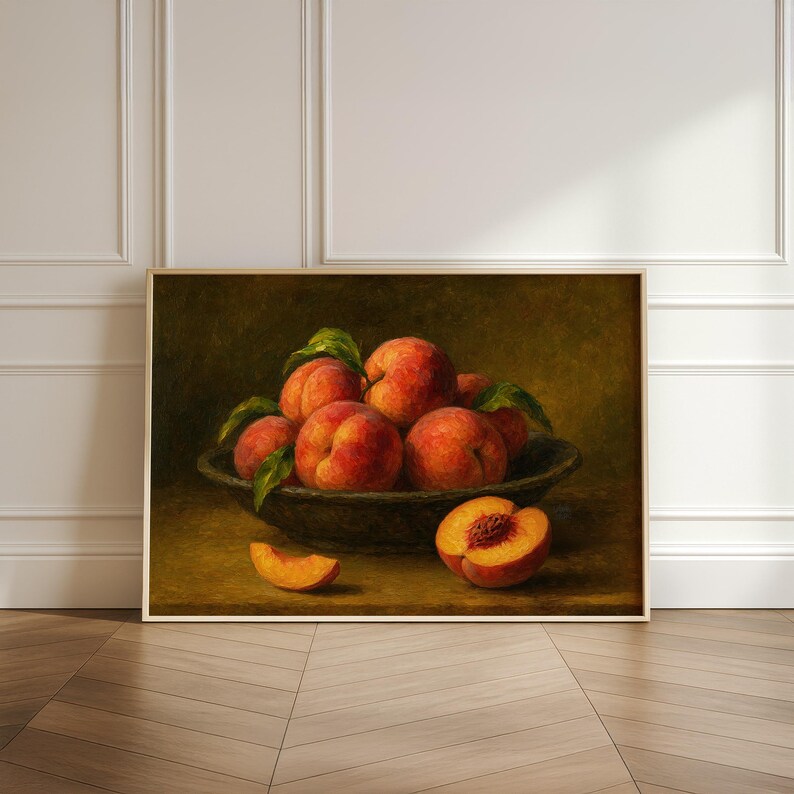 Oil painting print of a bowl of ripe peaches with leaves, a sliced peach and peach wedge on a table, classical moody fruit still life kitchen wall art