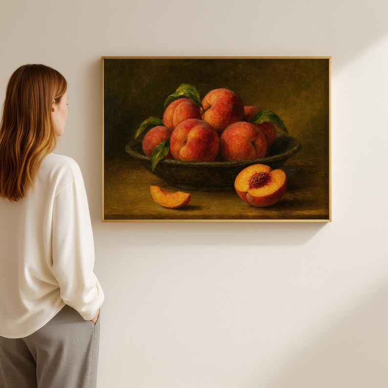 Oil painting print of a bowl of ripe peaches with leaves, a sliced peach and peach wedge on a table, classical moody fruit still life kitchen wall art