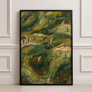 May include: A framed painting depicts a golf course scene with numerous miniature figures of golfers. The artwork features a vibrant palette of greens, browns, and yellows, with a black frame. The golfers are dressed in various colors, adding visual interest to the scene.