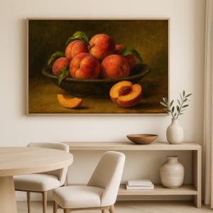 Oil painting print of a bowl of ripe peaches with leaves, a sliced peach and peach wedge on a table, classical moody fruit still life kitchen wall art