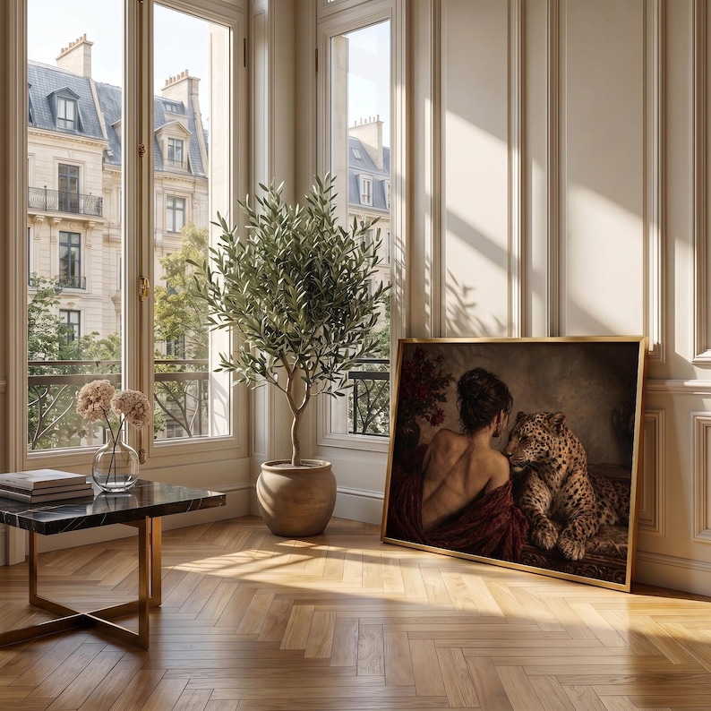 Leopard print showing a back-turned woman wrapped in burgundy fabric beside a reclining leopard in a dimly lit vintage interior.