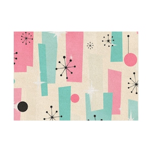 May include: A fabric pattern featuring a beige background with repeating vertical rectangles in pink and teal. The design includes black starburst shapes, solid black and pink circles, and small white four-pointed star accents scattered throughout.
