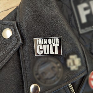 JOIN OUR CULT Enamel Pin -- Black and white, 1.5&quot; x 1&quot;
