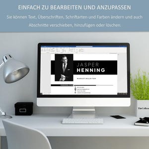 May include: A computer monitor shows a resume template with the name "JASPER HENNING" in bold text. The resume includes a photo and contact details. The text "EINFACH ZU BEARBEITEN UND ANZUPASSEN" is visible at the top. A desk lamp and a small plant are also visible.