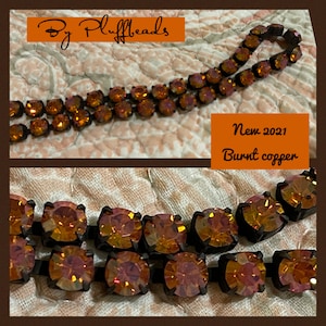 May include: A double row of burnt copper colored crystal beads on a black chain. The beads are faceted and have a slight iridescent shimmer. The text "New 2021 Burnt copper" is visible in the image.
