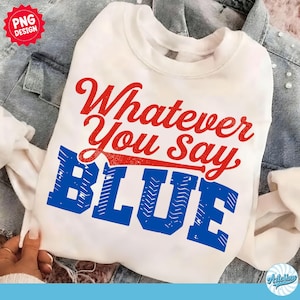 May include: White sweatshirt with the text "Whatever You Say BLUE" in red and blue. The sweatshirt is displayed on a denim jacket.