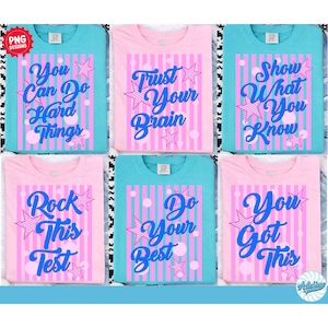 以下が含まれることがあります： ピンクとターコイズブルーの6枚のTシャツ。それぞれに青いスクリプトで書かれたユニークなモチベーションメッセージが書かれています。「You Can Do Hard Things」や「You Got This」などのフレーズが、星のグラフィックと縦縞でアクセントされています。
