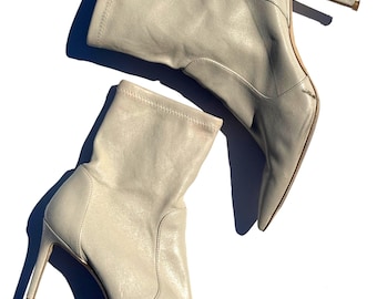 38 // white crème pointed high ankle mid heel power bootie by stewart weitzman