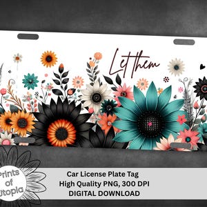 May include: White car license plate tag with a floral design. The design features large black, teal, orange, and pink flowers with the words "Let them" in a script font. The tag has two holes at the top.
