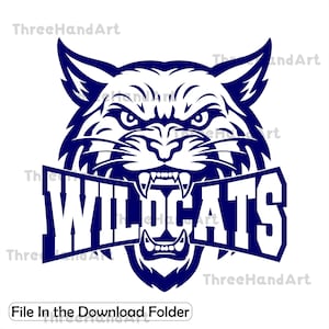 May include: A navy blue graphic of a snarling wildcat head with the word "WILDCATS" in bold, white letters across its mouth. The image has sharp lines and a fierce expression, suitable for sports team logos or school spirit designs.