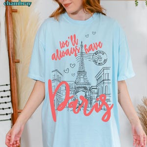 We'll Always Have Paris Shirt from Paris with Love Belly and Conrad Emily in Paris Inspired Comfort Colors Cotton T-Shirt Romantic Paris Tee in light blue chambray