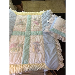 May include: A set of three ceramic mugs with a speckled, matte finish. The mugs are in shades of cream, light gray, and dark gray. Each mug has a simple, minimalist design, perfect for coffee or tea.