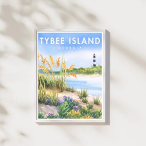 May include: A framed watercolor print of Tybee Island, Georgia. The artwork depicts a beach scene with a lighthouse, sand dunes, and colorful wildflowers under a blue sky. The text "TYBEE ISLAND GEORGIA" is at the top.